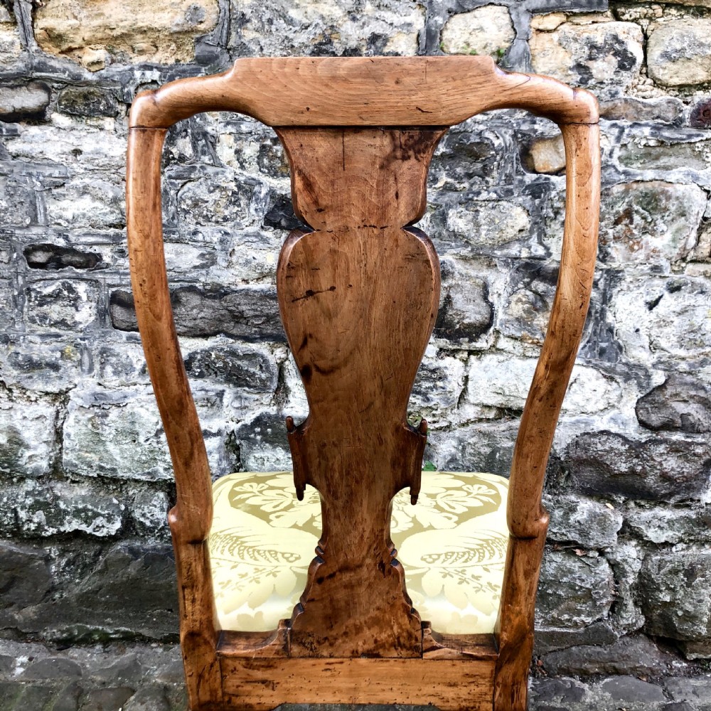 A Queen Anne walnut side chair featuring a vasiform back splat, cabriole front legs with pad feet, and a yellow patterned silk upholstered seat. View IX