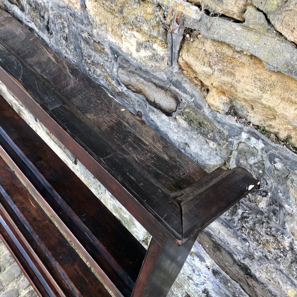 A dark oak 18th-century plate rack featuring three wide horizontal display shelves topped with a moulded cornice. View IV
