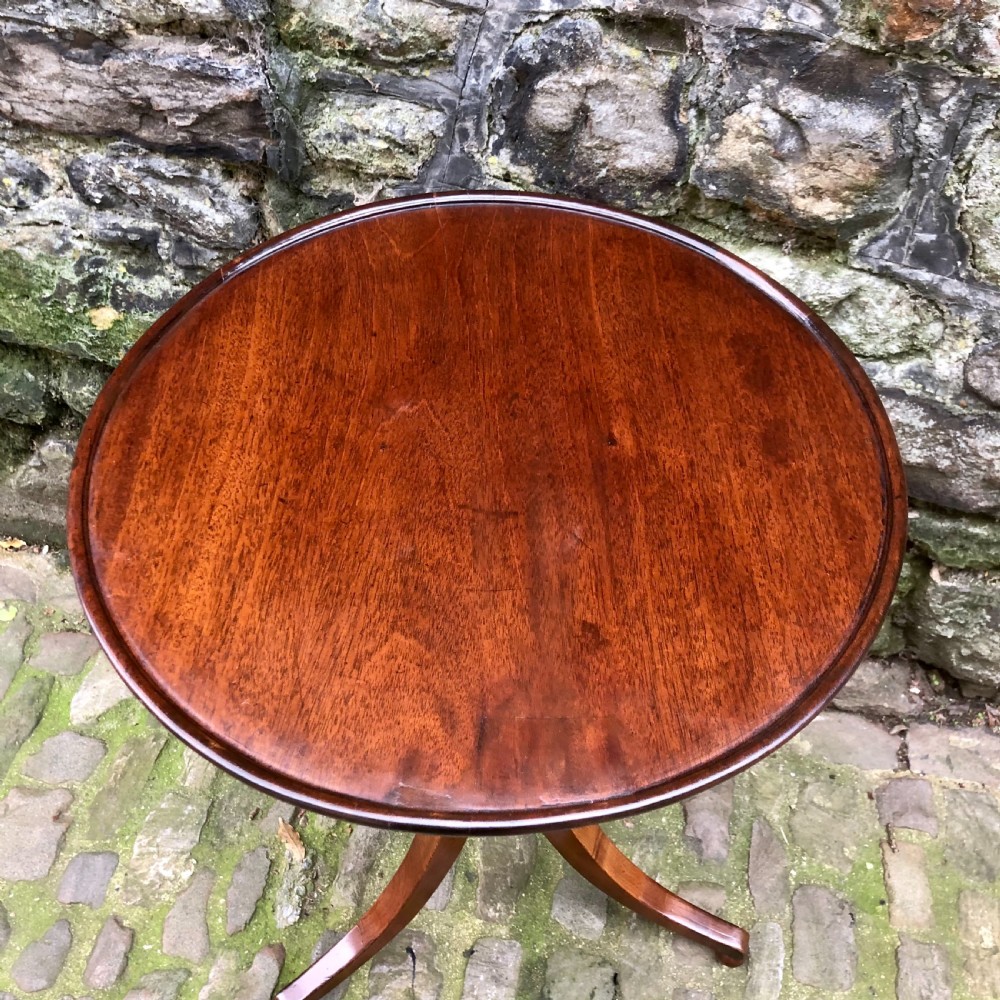 A George III mahogany and cherrywood wine table View II