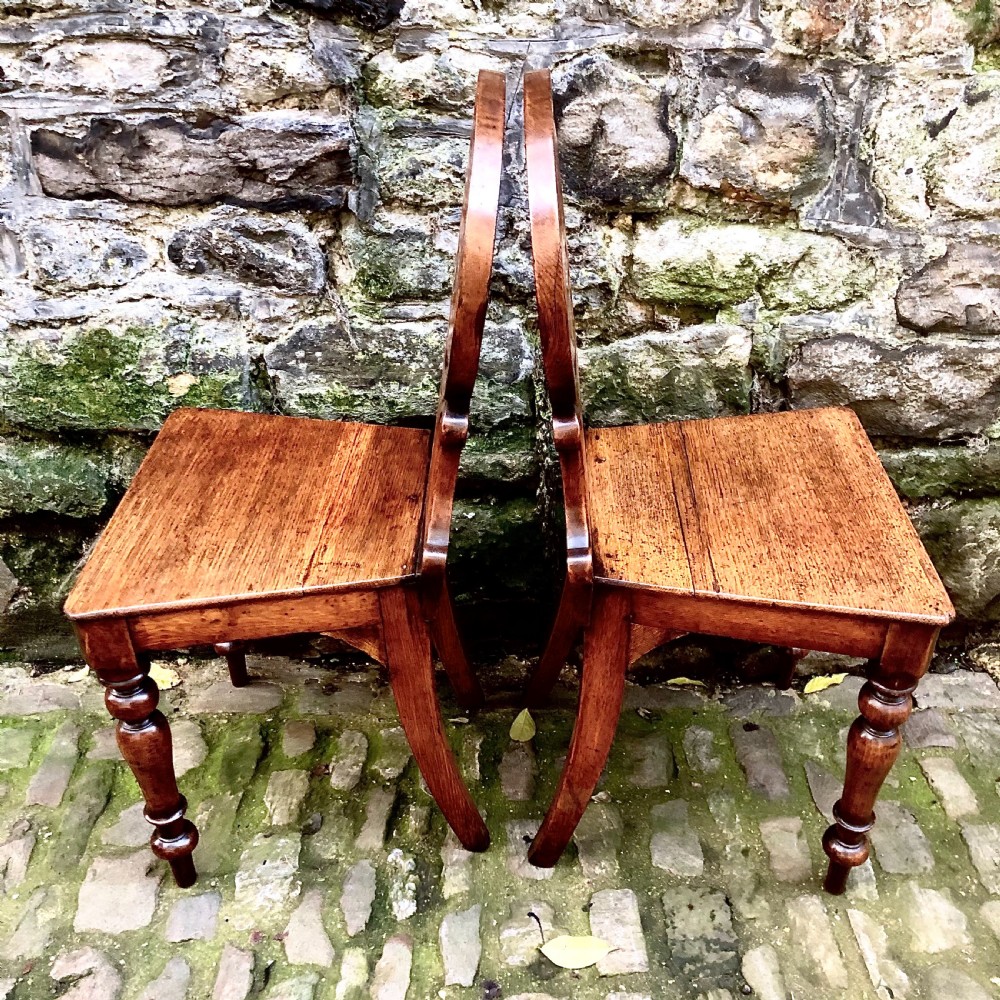 A pair of early Victorian oak hall chairs  View III