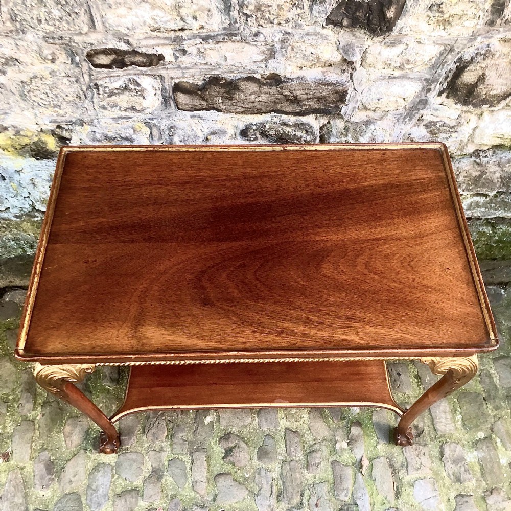 A late nineteenth-century two-tier walnut coffee table featuring carved gilded cabriole legs and a polished lower shelf. View III