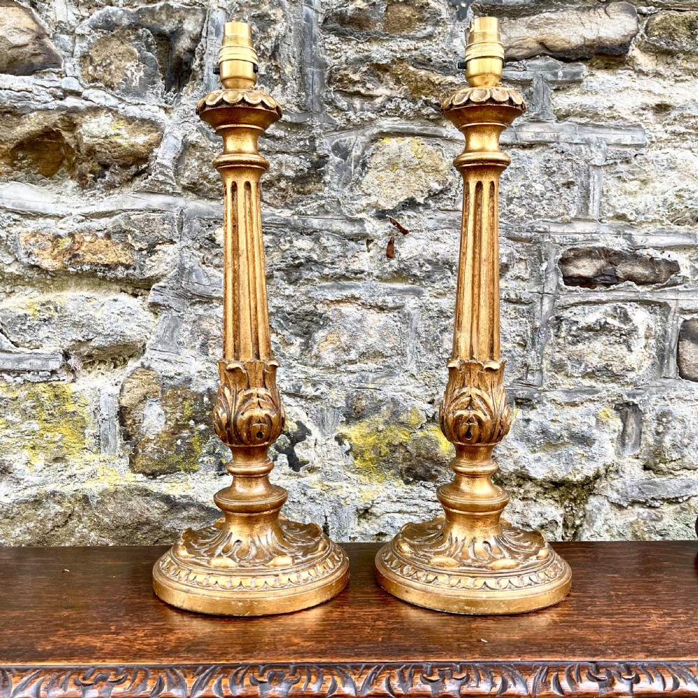 A pair of early 20th century giltwood table lamps