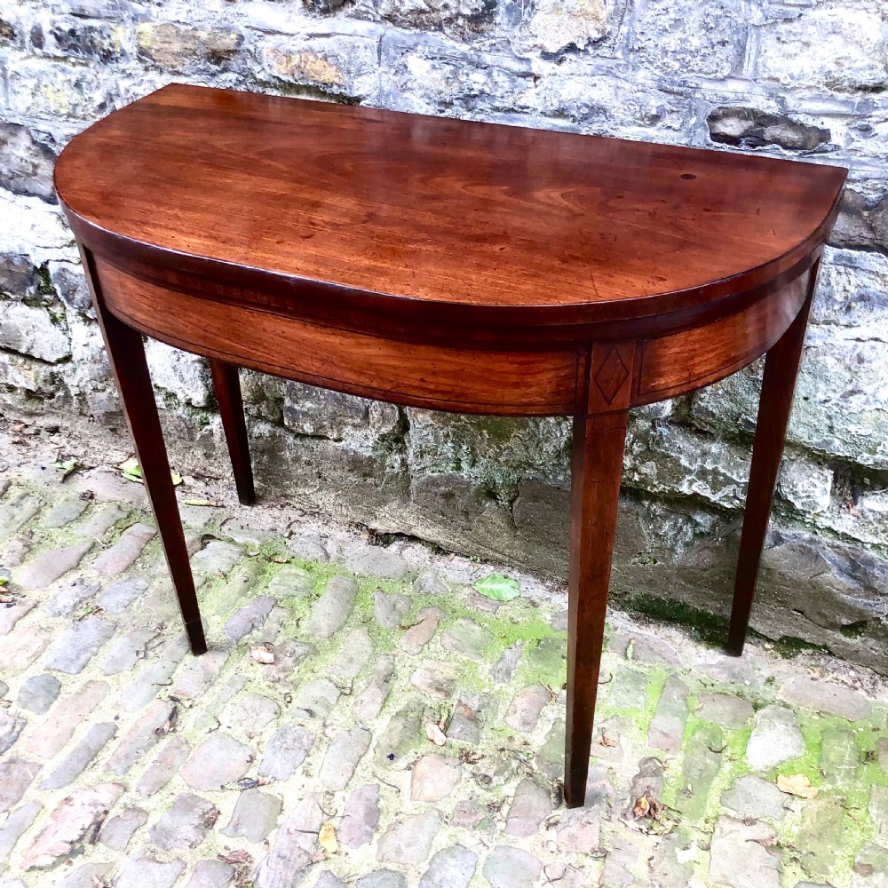 A George III mahogany card table View III