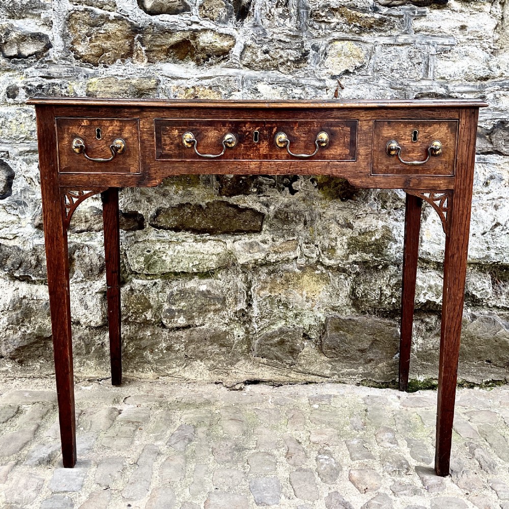 A George III oak lowboy View III