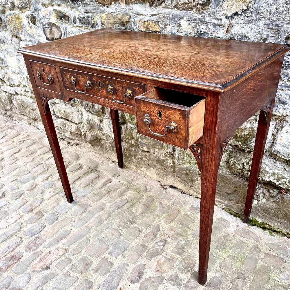 A George III oak lowboy View IV