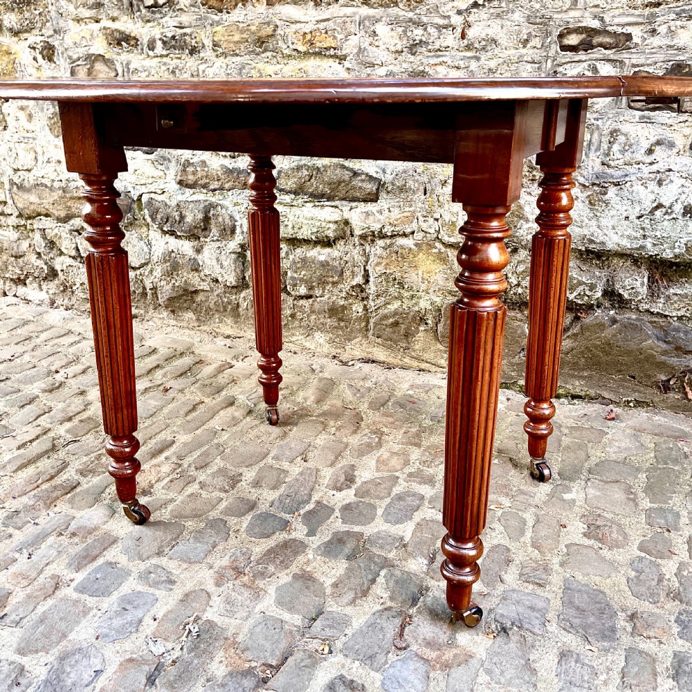 A William IV Mahogany Small Extending Dining Table View IX