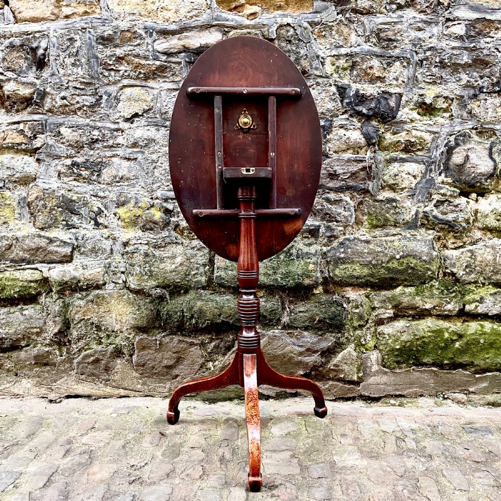 A George III mahogany tilt-top wine table  View II