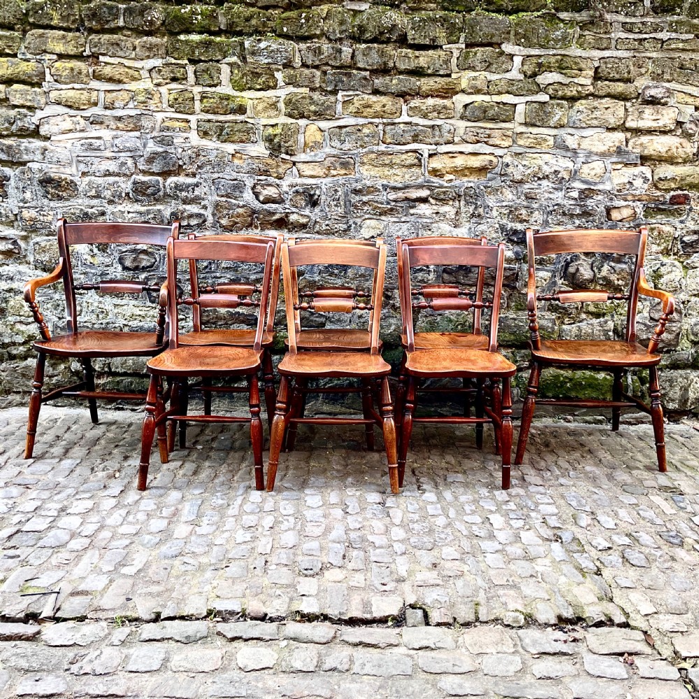 A set of eight mid Victorian kitchen chairs View II