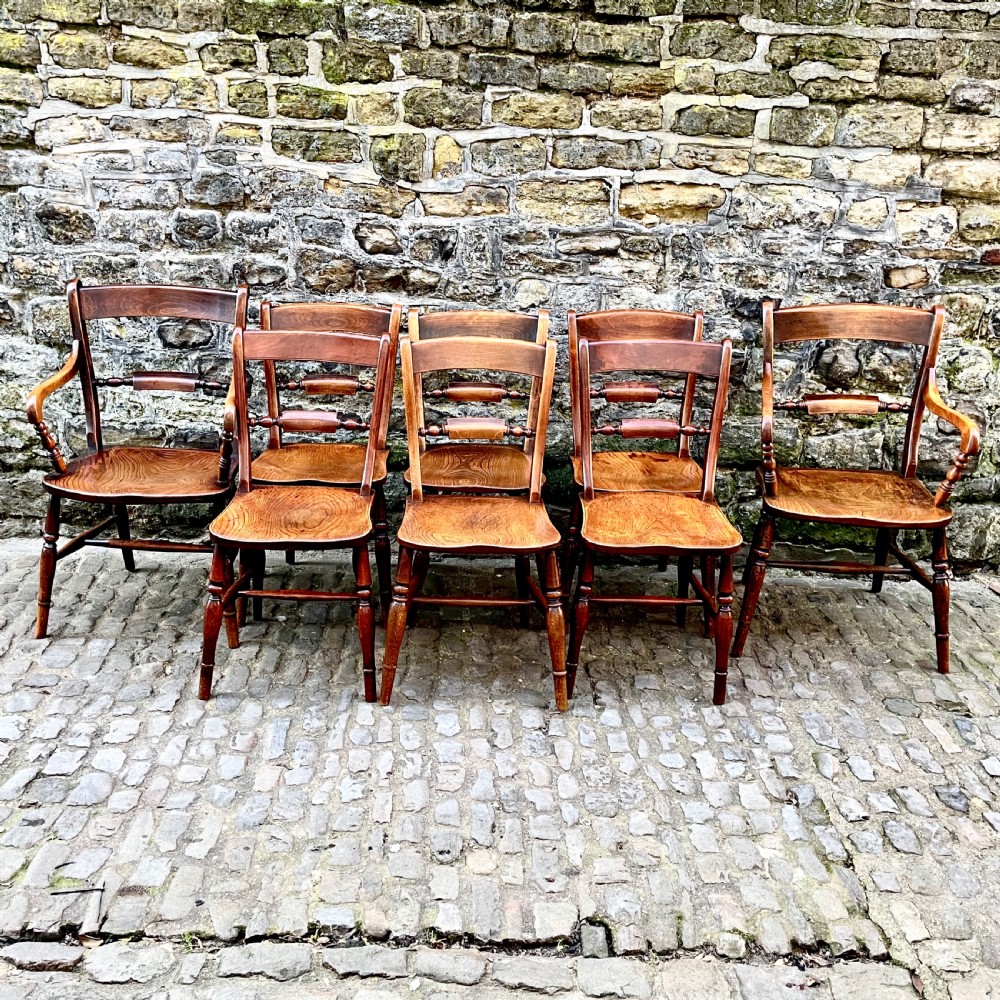 A set of eight mid Victorian kitchen chairs View XI