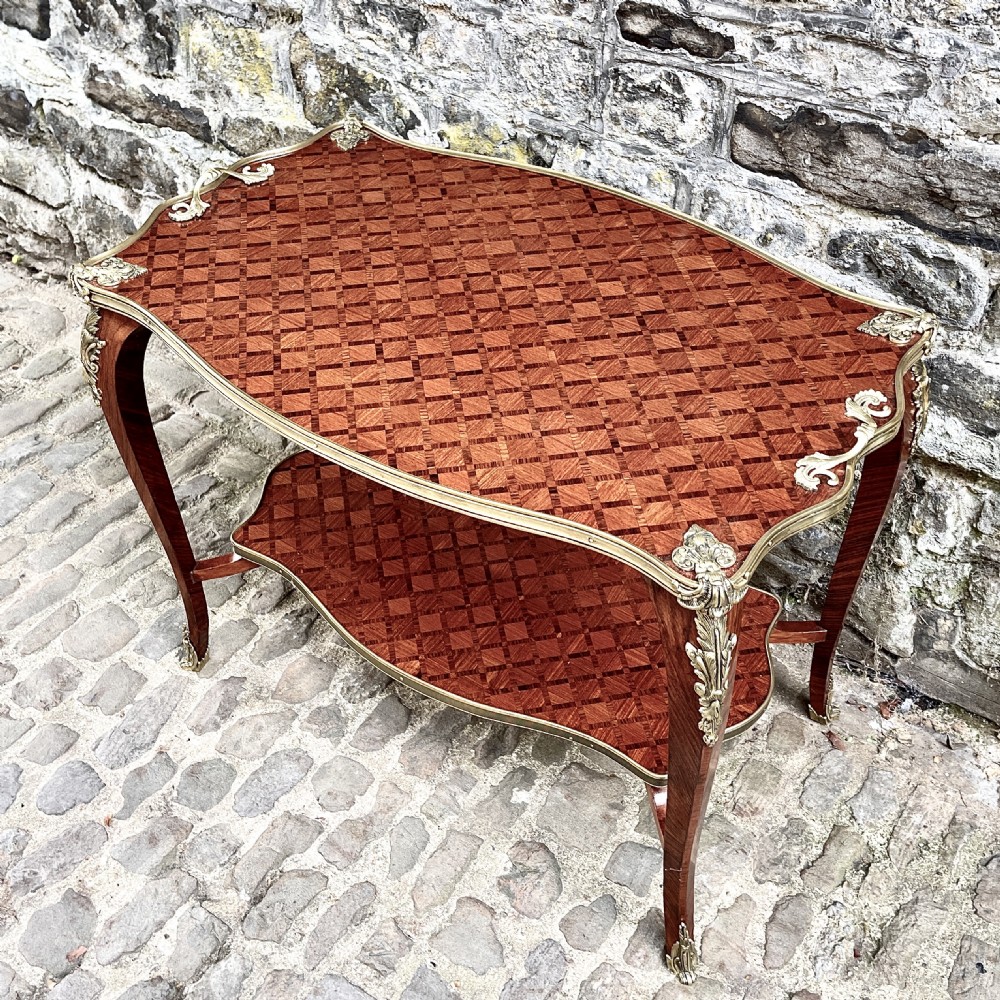 A late 19th Century French Kingwood Two Tier Table View IV