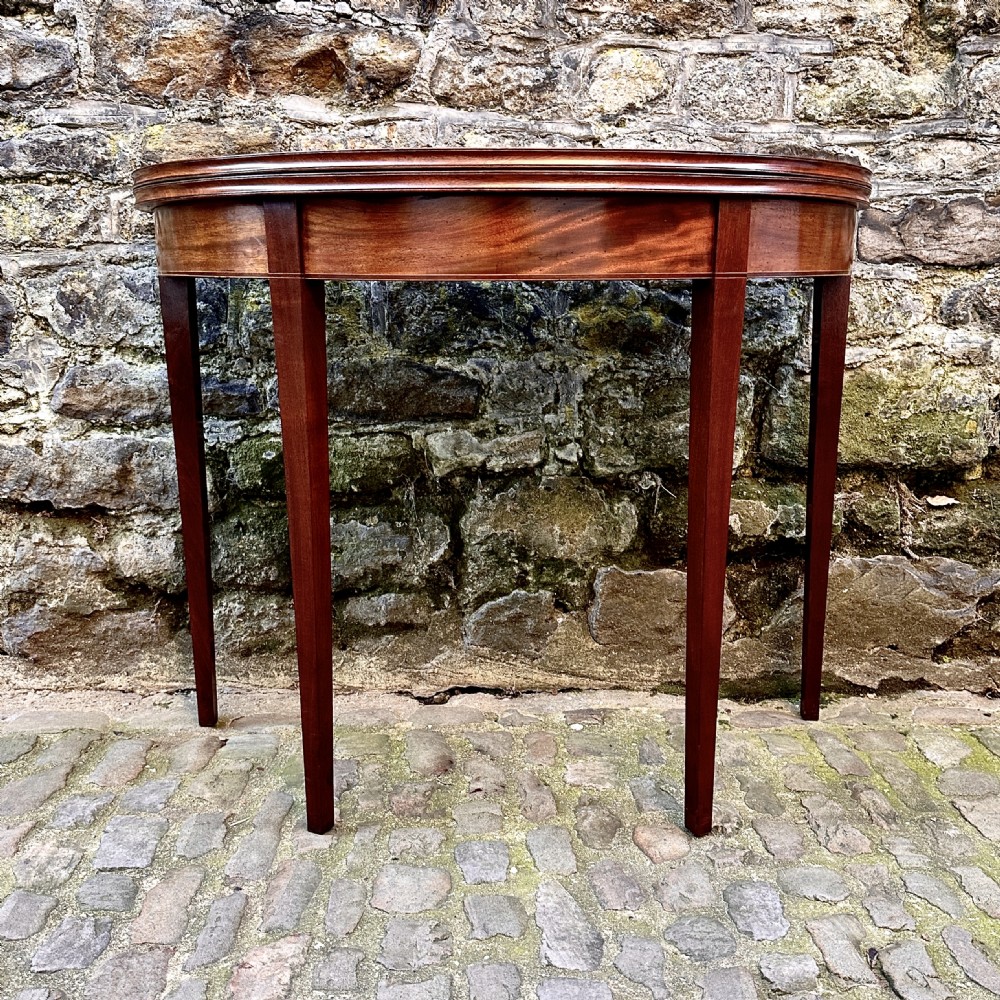 A George III Mahogany Demilune Tea Table