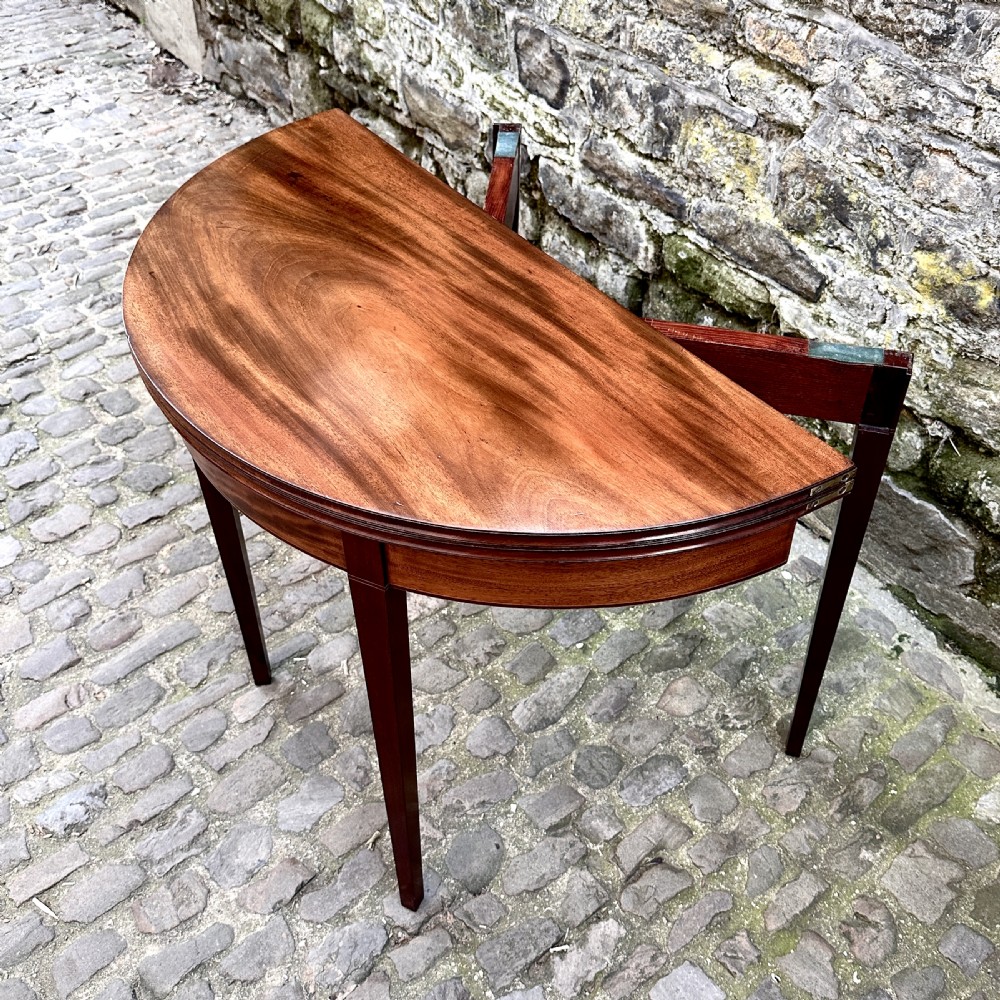 A George III Mahogany Demilune Tea Table View V
