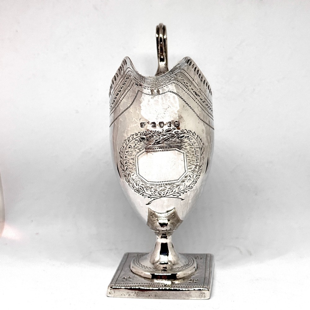 A George III Silver Helmet Cream Jug View II