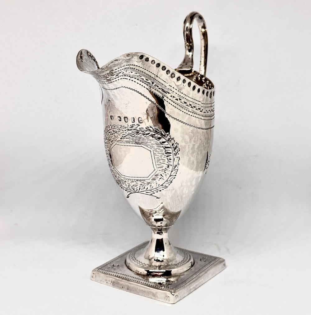 A George III Silver Helmet Cream Jug View III
