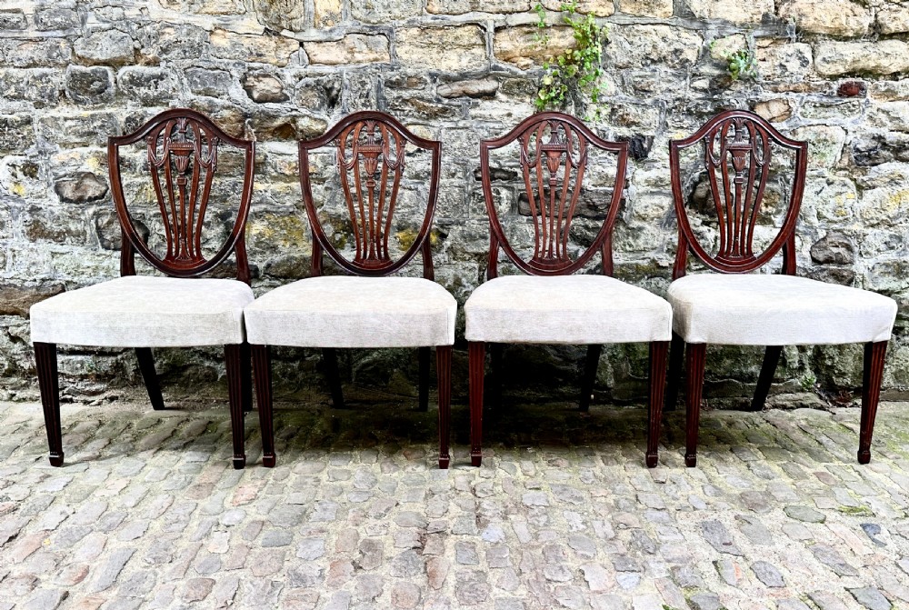 A Set of Four George III Shield Back Dining Chairs View X
