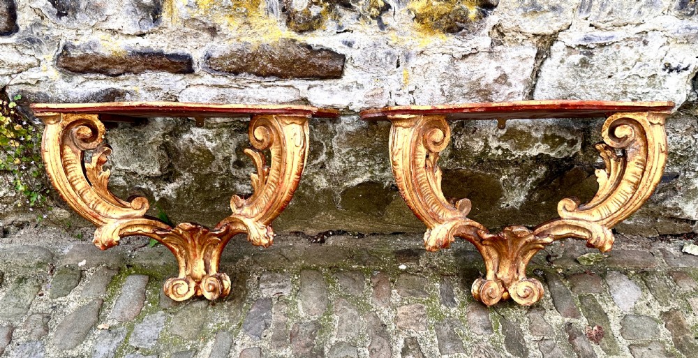 A Pair of 18th Century Italian Giltwood Console Tables