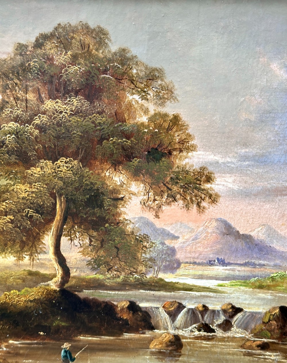 An early 19th-century English oil painting depicting a river landscape with a waterfall and mountains, set in a carved gilt frame. View IV