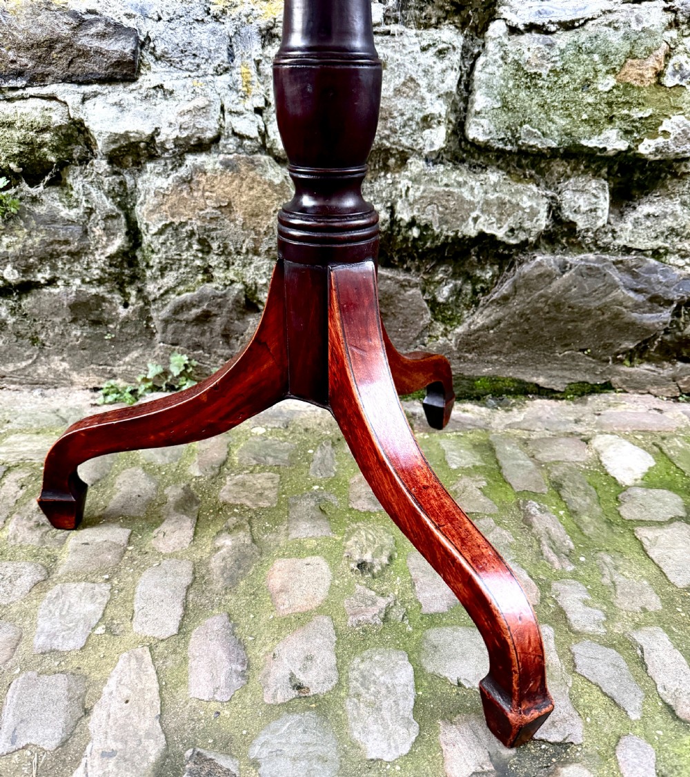 A Regency mahogany tripod side table featuring a rounded rectangular top supported by a turned central pedestal and three splayed legs. View III