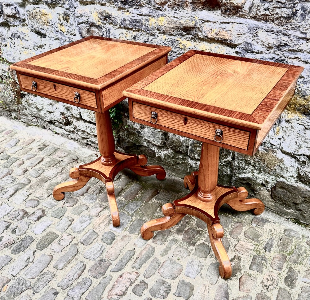 A pair of early 20th century ash pedestal side tables featuring single drawers with brass lion mask ring handles and quadruped scrolled bases. View III