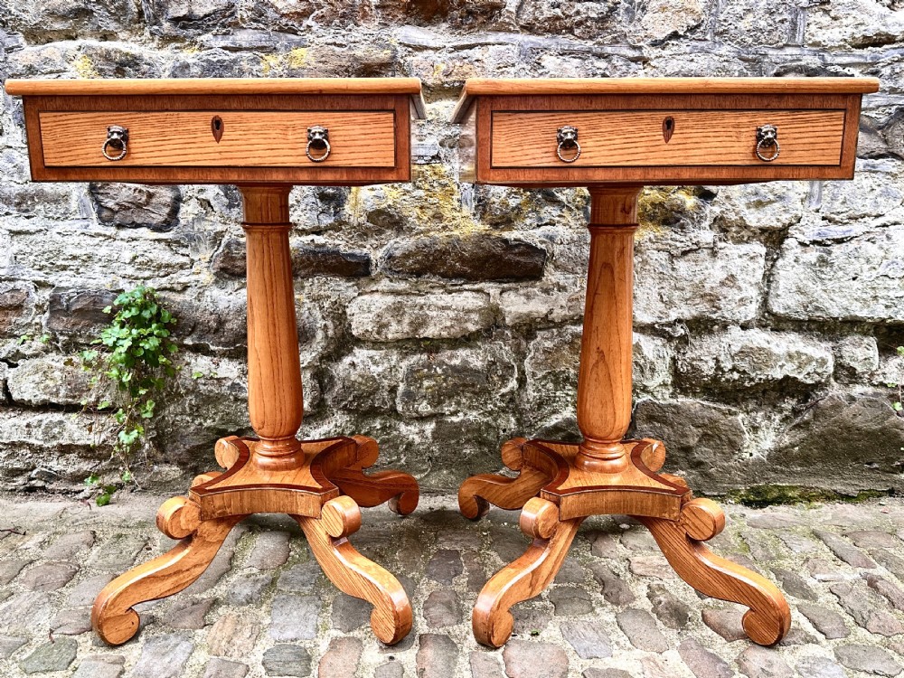 A pair of early 20th century ash pedestal side tables featuring single drawers with brass lion mask ring handles and quadruped scrolled bases. View VIII