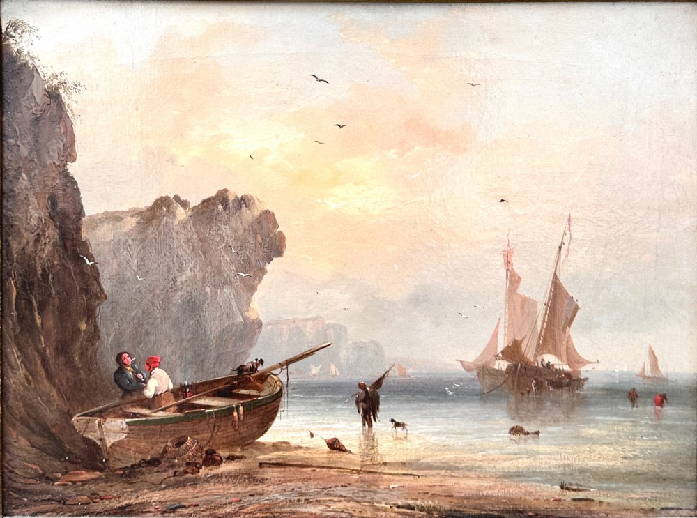 An early nineteenth-century oil painting depicting figures and boats along a rocky coastline, presented in an ornate swept giltwood frame. View II