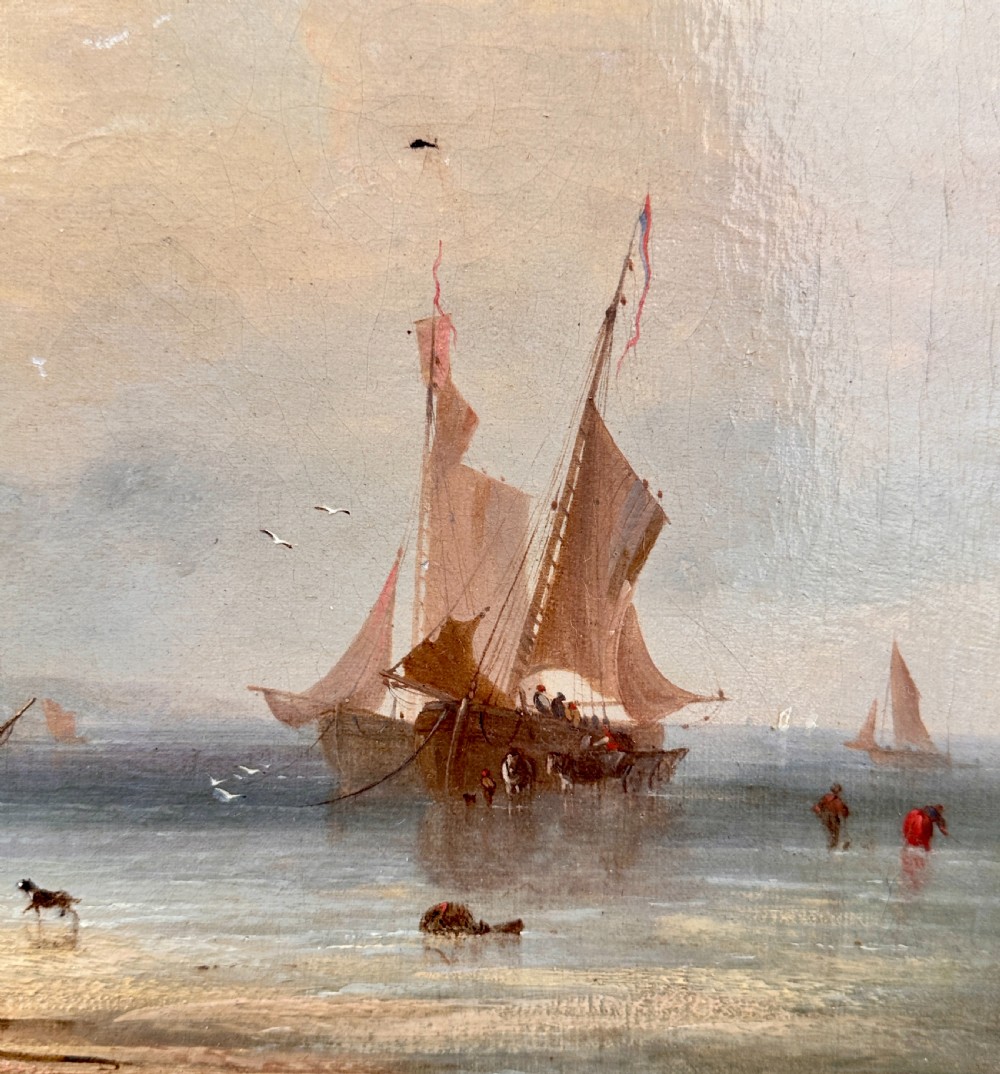 An early nineteenth-century oil painting depicting figures and boats along a rocky coastline, presented in an ornate swept giltwood frame. View IV