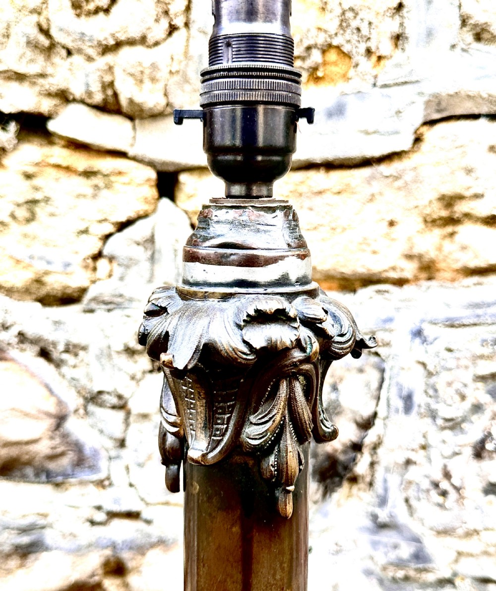 A French Art Nouveau cast bronze table lamp base featuring sweeping organic foliate motifs and a fluted central column. View VI