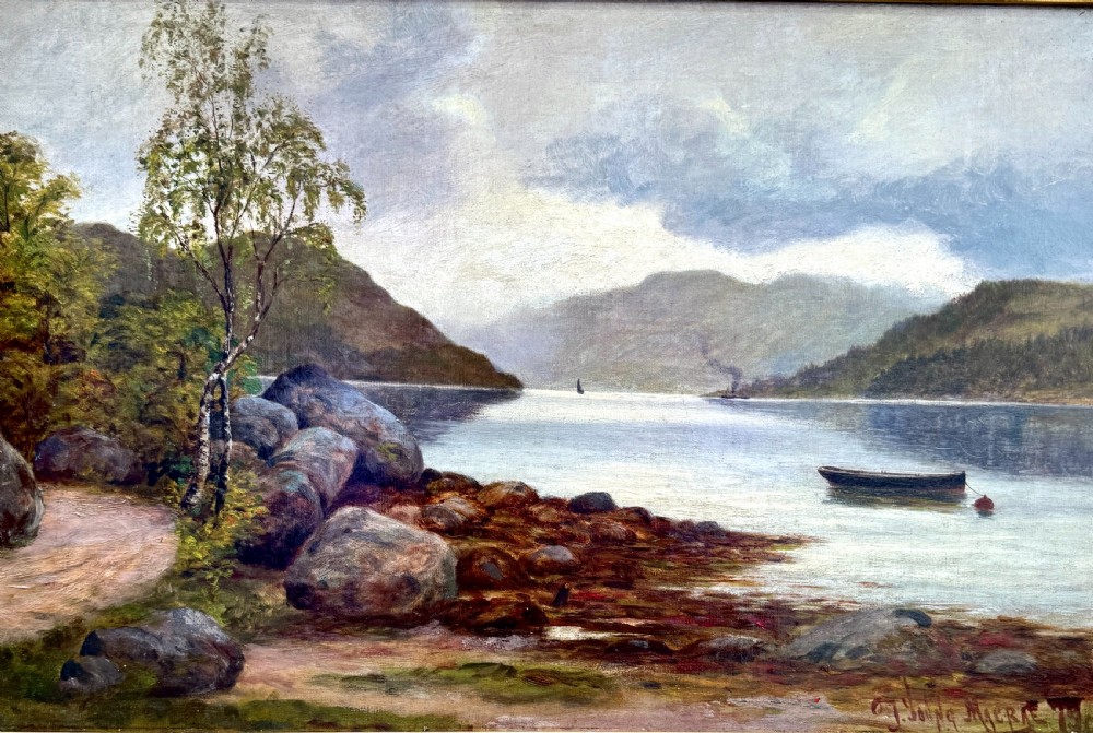 A Victorian oil painting depicting a calm Scottish loch with trees, rocky shorelines, and distant hills set inside a heavy moulded gilt wood frame. View II