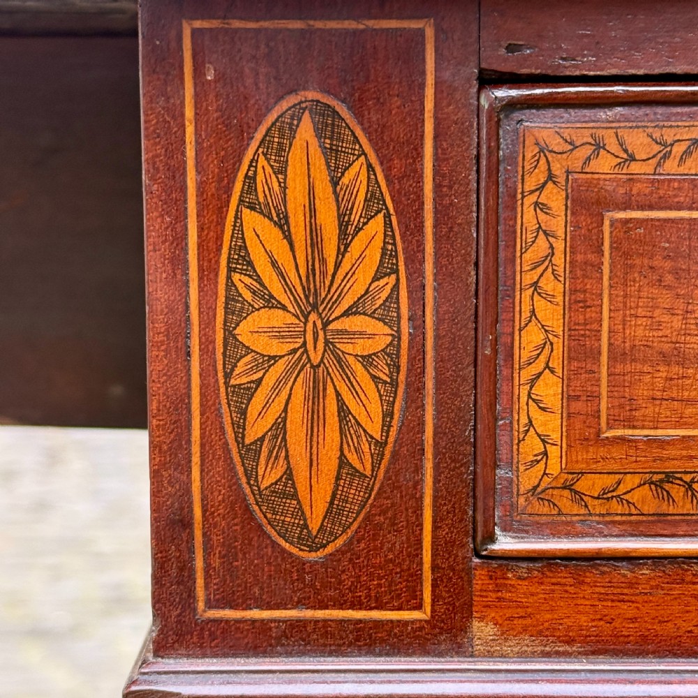 A George III mahogany Pembroke table with satinwood inlay, tapered square legs, and brass castors. View VII