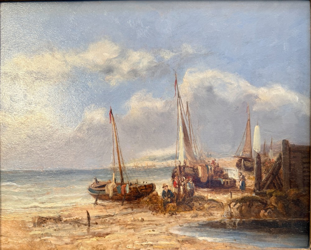 A nineteenth-century coastal oil painting depicting figures and fishing boats on a sandy shore under a cloudy sky, presented in a moulded gold frame. View II