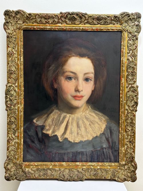 fig 1. A Victorian portrait painting of a young female wearing a ruffled collar and blue dress, presented in an ornate gilded frame.