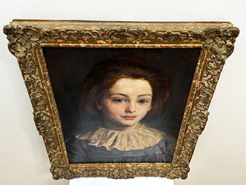 fig 3. A Victorian portrait painting of a young female wearing a ruffled collar and blue dress, presented in an ornate gilded frame.