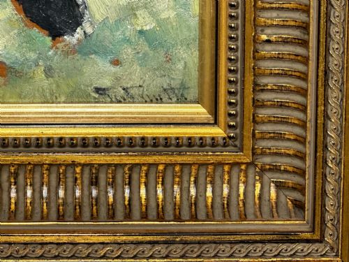 fig 4. An impressionist oil painting depicting a black and white Friesian cow grazing in a field, set within a heavily moulded gilt frame.