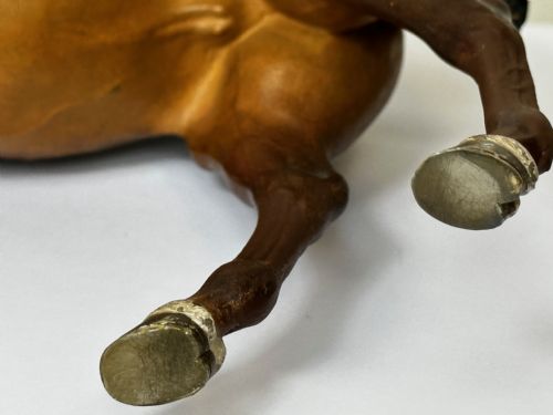 fig 4. A Victorian cold-painted bronze figure depicting a standing bay hunter horse complete with detailed saddle and bridle.