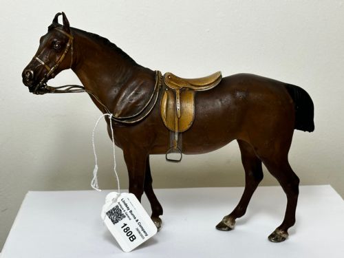 fig 6. A Victorian cold-painted bronze figure depicting a standing bay hunter horse complete with detailed saddle and bridle.