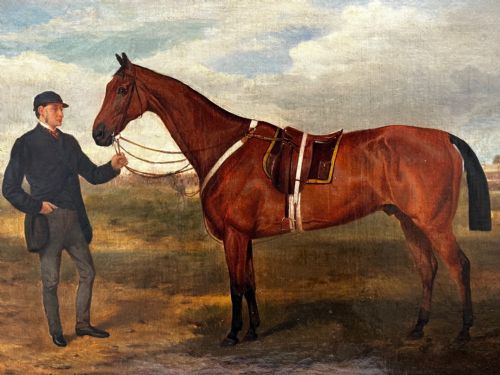 fig 6. A 19th-century British oil painting depicting a saddled bay hunter horse and groom standing in a landscape, set within a timber frame.