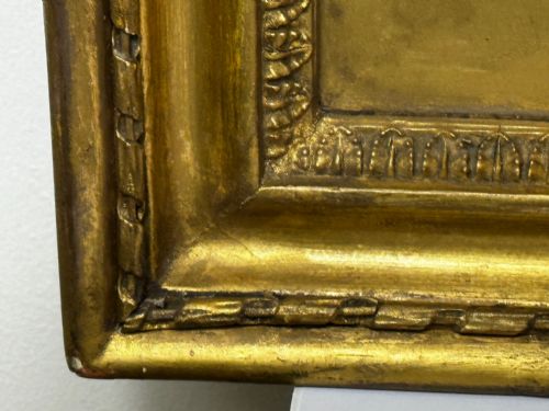 fig 7. An 18th-century oil portrait of a lady in a black bodice and feathered headpiece within an oval spandrel inside a square gilded frame.