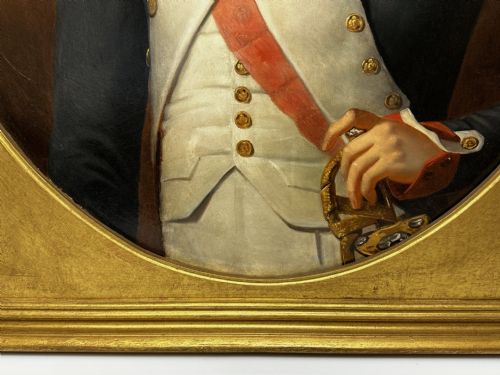 fig 3. A 19th-century French oil painting depicting Napoleon Bonaparte in military uniform with epaulettes, set within an oval spandrel inside a rectangular gilded wood frame.