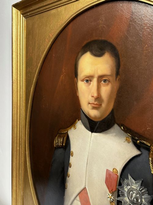fig 5. A 19th-century French oil painting depicting Napoleon Bonaparte in military uniform with epaulettes, set within an oval spandrel inside a rectangular gilded wood frame.