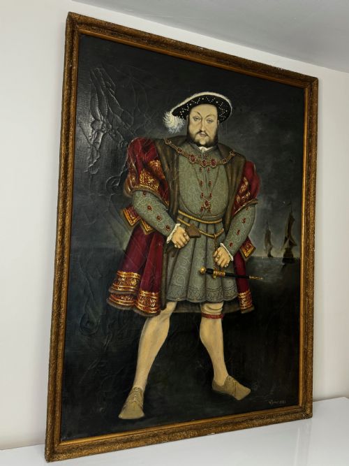 fig 1. A large oil painting in a gilded frame depicting King Henry VIII standing in Tudor costume with jewels, dagger, and feathered cap against a dark backdrop.