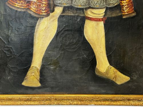 fig 5. A large oil painting in a gilded frame depicting King Henry VIII standing in Tudor costume with jewels, dagger, and feathered cap against a dark backdrop.