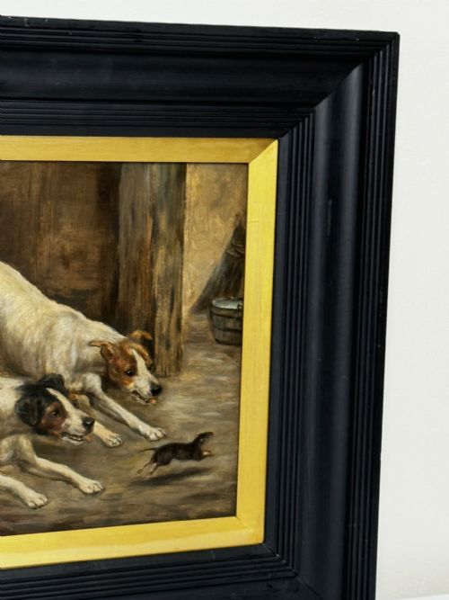 fig 2. A Victorian oil painting framed in ebonised timber and a gilt slip, depicting two white and dark-marked terriers pursuing a rat inside a barn.