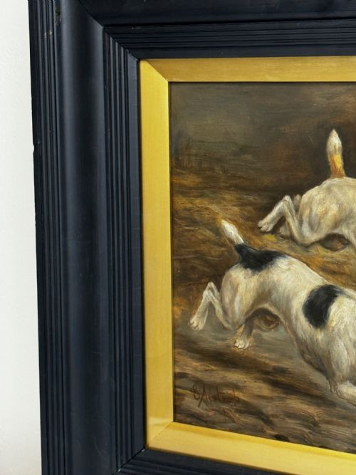 fig 5. A Victorian oil painting framed in ebonised timber and a gilt slip, depicting two white and dark-marked terriers pursuing a rat inside a barn.