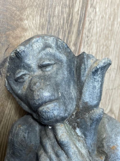 fig 2. A Victorian grey lead sculpture of a contemplative monkey mounted on a cylindrical metal stake.