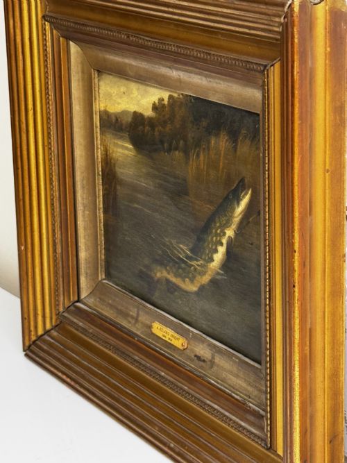 fig 3. An antique Victorian oil painting depicting a northern pike fish surfacing from a river, set within a gilded moulded frame.