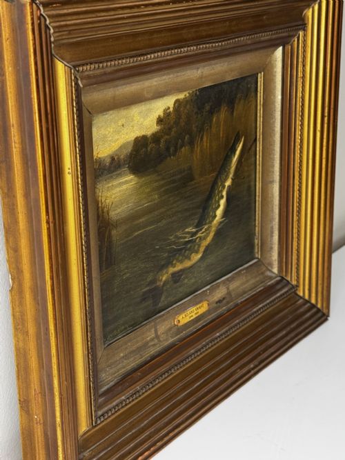 fig 5. An antique Victorian oil painting depicting a northern pike fish surfacing from a river, set within a gilded moulded frame.