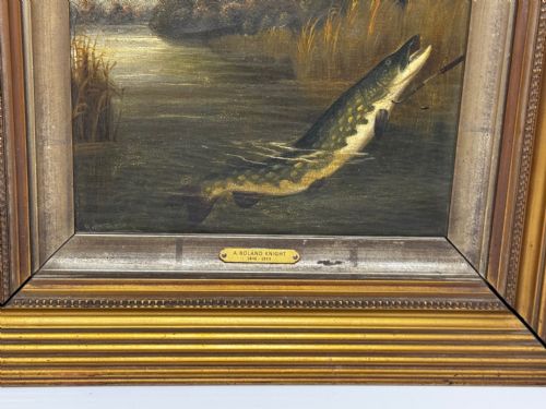 fig 7. An antique Victorian oil painting depicting a northern pike fish surfacing from a river, set within a gilded moulded frame.