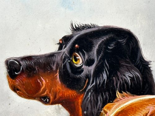 fig 2. An antique Victorian oil painting depicting two setters against a cloudy sky, presented in a carved gold gilt frame.