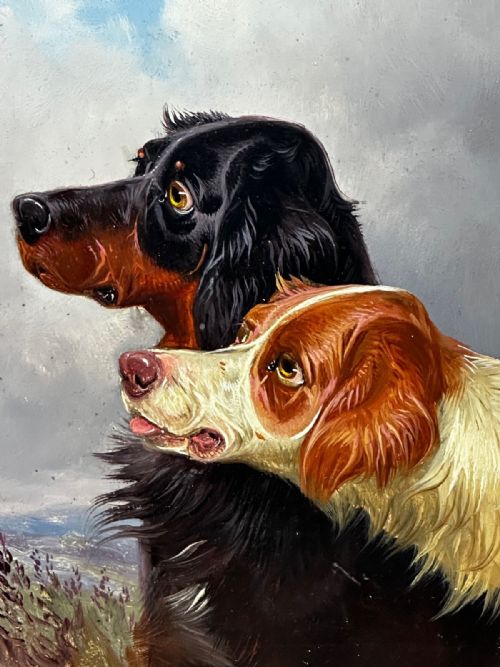 fig 3. An antique Victorian oil painting depicting two setters against a cloudy sky, presented in a carved gold gilt frame.