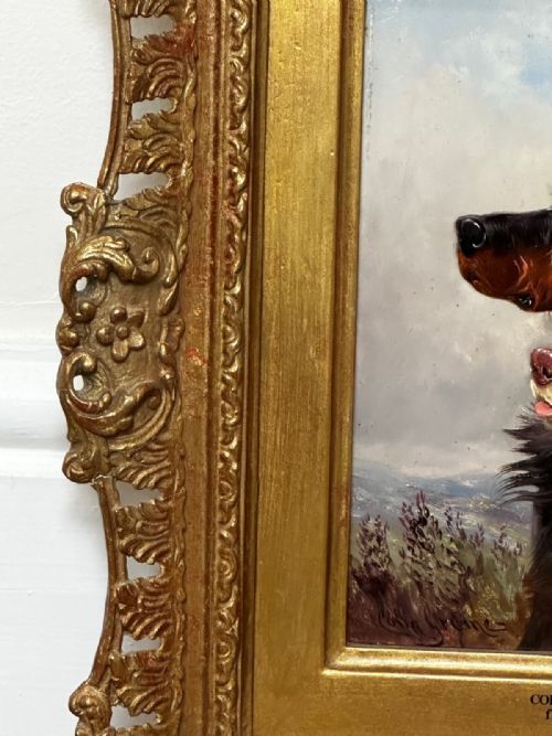 fig 4. An antique Victorian oil painting depicting two setters against a cloudy sky, presented in a carved gold gilt frame.
